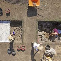 Fig. 8. Overhead photograph of the excavation in progress at trenches 5 and 6. One of the very large masses of travertine (called “monsters” in the text) has just been excavated, and it is now sitting on the west side of trench 5. (photo M. Holobosky)